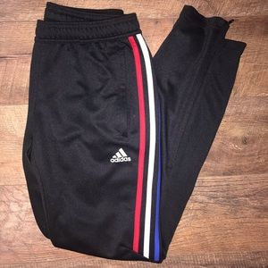 Black Adidas pants with red white and blue stripes